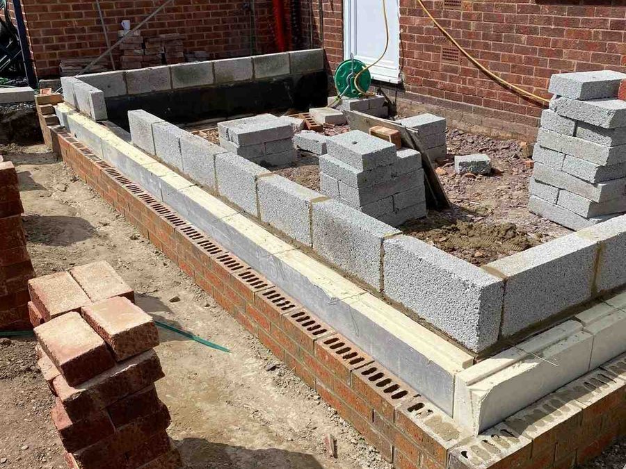 Extension footings and blockwork at an early stage of the build